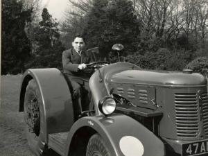 HM King Hussein in a David Brown tractor the day he visited Aston Martin to pick up his DB2. David Brown was a tractor manufacturer who bought the Aston Martin company.
